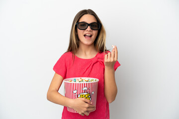 Little girl over isolated white background with 3d glasses and holding a big bucket of popcorns