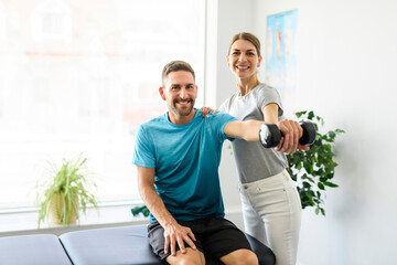 Modern rehabilitation physiotherapy woman worker with man client