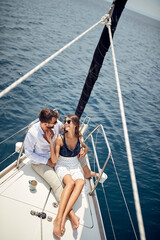 Classy rich couple cruising together; Luxurious lifestyle concept - 504397897