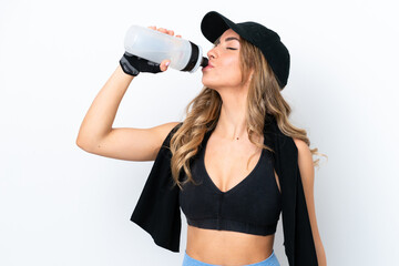 Young caucasian woman isolated on white background with sports water bottle