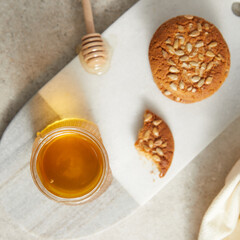 Overhead view of honey jar and cookies
