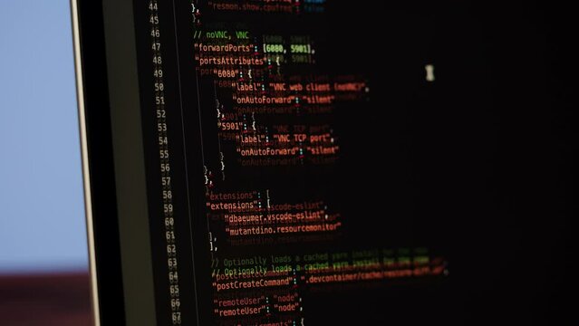 Programmer using laptop. Program code and script data on the screen close-up. Hacker attack. 