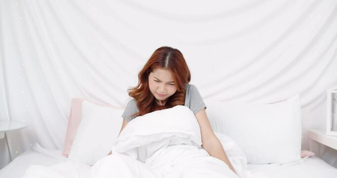 Calm young woman sleeping well in comfortable cozy fresh bed on soft pillow white linen orthopedic mattress, peaceful serene girl resting lying asleep enjoying healthy good sleep nap in the morning