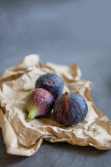 Figs on a dark background on craft paper.