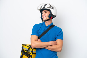 Young caucasian man with thermal backpack isolated on white background happy and smiling