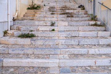 Old stone marble stair going up at Ermoupolis, Syros island, Cyclades Greece.
