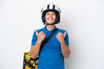 Young caucasian man with thermal backpack isolated on white background with thumbs up gesture and smiling