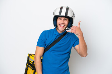 Young caucasian man with thermal backpack isolated on white background making phone gesture. Call me back sign