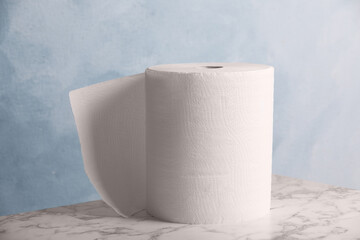 Roll of paper towels on white marble table