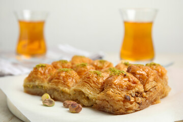 Delicious sweet baklava with pistachios on table, closeup