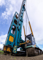 piling machine shot with distortion by a short-focus lens
