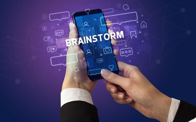Hand using smartphone with social media concept