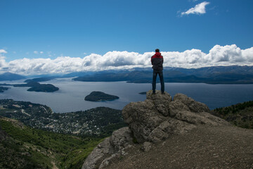 A man looks at the landscape in San Carlos de Bariloche. a city in the Argentinian province of Rio Negro.
