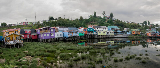 Obraz premium Houses on stilts (palafitos) in Castro, Chiloe Island, Patagonia, Chile