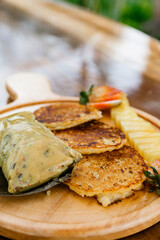 Delicious breakfast with egg and corn cake