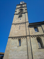 Zurich, Switzerland - August 18, 2019: Beautiful view of the romanesque Grossmunster Church against the blue sky. Vertical