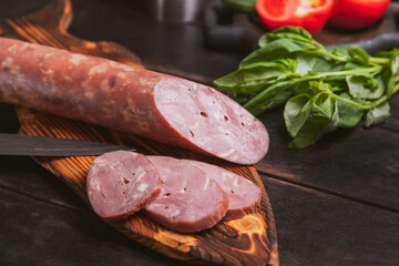 Still life with homemade duck sausage, boiled and smoked