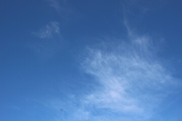 Naklejka na ściany i meble bright blue sky with smoky clouds