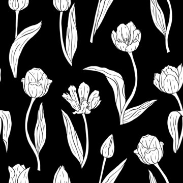 Monochrome vintage seamless pattern with tulips flowers white silhouettes on black background
