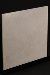Fototapeta premium Porcelain tiles with a stone texture on a dark gray background