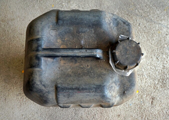 Top view of dirty old black gallon