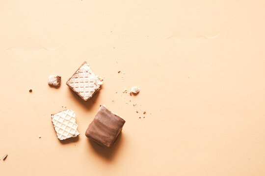 Half Eaten Dark Chocolate On A Plate On Table 