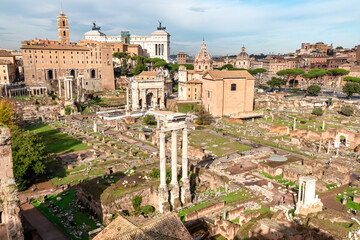 Obraz premium Panoramic view on ancient ruins of Roman Forum and Rome Skyline from Palatine Hill in city of Rome, Lazio, Italy, Europe, EU. Looking on Antoninus and Faustina Temple, Victor Emmanuel II monument