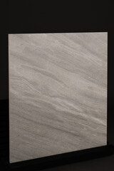 Porcelain tiles in the form of a marble on a dark gray background