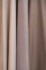 Fototapeta premium Folded fabric for curtains. Beige curtains.