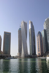 Fototapeta na wymiar Skyscrapers and artificial canal in Dubai Marina