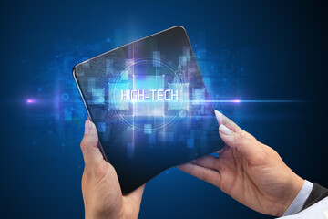 Businessman holding a foldable smartphone