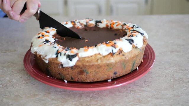 Woman Attempts To Cut Into Hard Cookie Cake