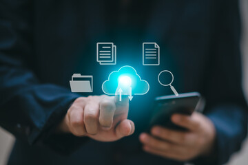 A man uses a smartphone to access an online document database. and automated processes to store...