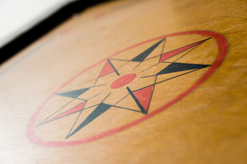 Center star on a wooden carrom board