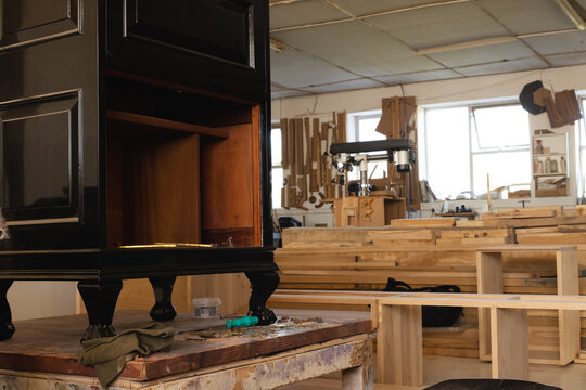 Interior of workshop with incomplete wooden cabinet