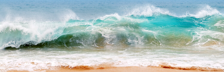 Blue and aquamarine color sea waves and yellow sand  with white foam. Marine beach background. Banner format. - 504447222