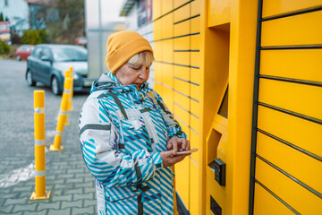 Woman client using automated self service post terminal machine or locker. Freight transportation....