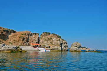 view of bay from the sea, boat on the beach, eagean island