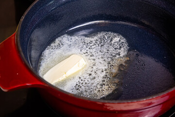 in a saucepan on the stove melt butter for the preparation of bechamel sauce and other dishes.
