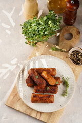 Traditional south european skinless sausages cevapcici made of ground meat and spices on white...