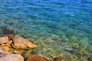 Beach, sea coast with beautiful, picturesque rocks, mountains and clear blue water. Summer vacation, tourism, travel, Herceg Novi, Montenegro, Adriatic Sea