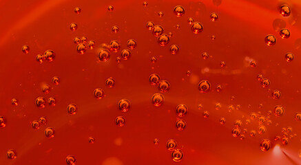 Abstract background of vivid orange tone color bubbles in liquid. 