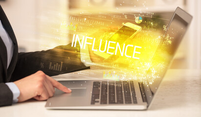 Closeup of businessman hands working on laptop