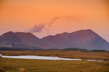 Beautiful sunset view of Connemara region in Ireland. Scenic Irish countryside landscape with...