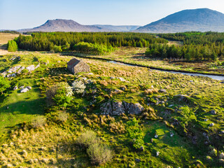 Beautiful aerial sunset view of Connemara region in Ireland. Scenic Irish countryside landscape...