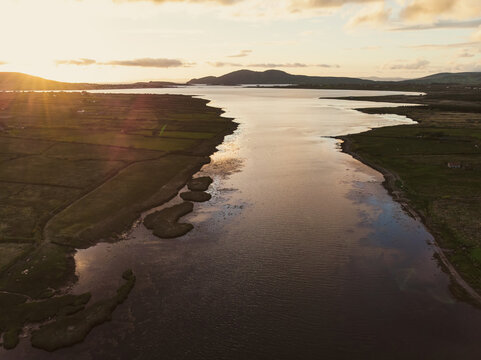 Beautiful aerial sunset view of Connemara region in Ireland. Scenic Irish countryside landscape with magnificent mountains on the horizon, Ireland