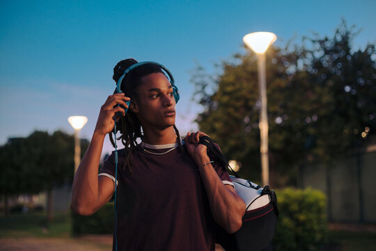 Multiracial man at night
