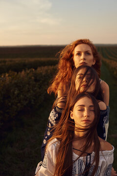 Close up in a row of faces of three different women with