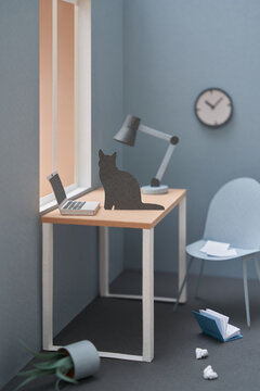 Papercraft cat on working desk