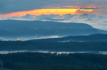 Southern Urals, Ural Mountains in summer. Sunset in the mountains. The top of a mountain ridge.